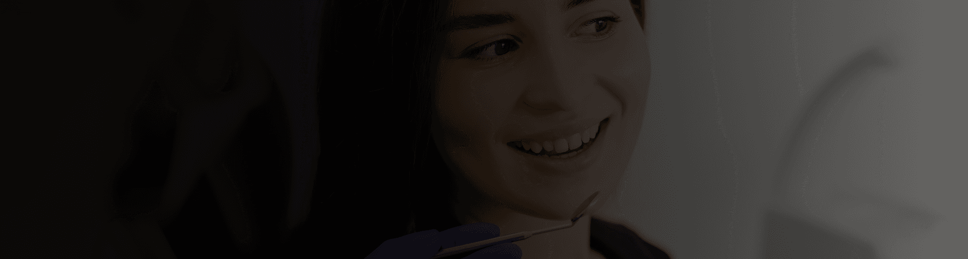 Patient smiling during a dental visit