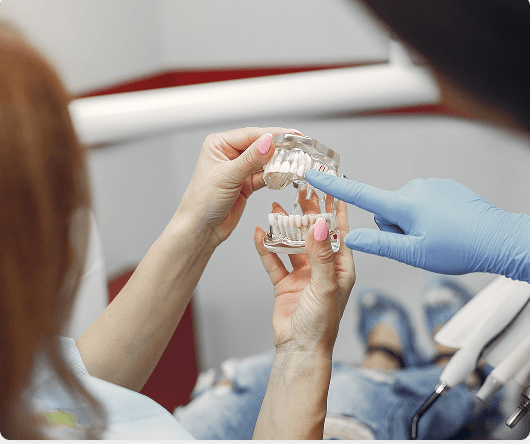 Dental hygienist cleaning a patient's teeth