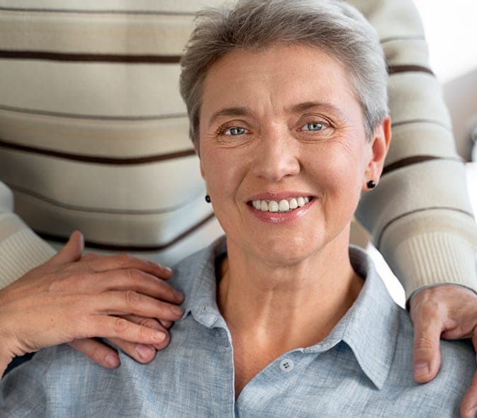 Smiling senior woman with a family member