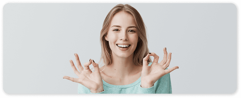Smiling patient celebrating her clear aligner progress